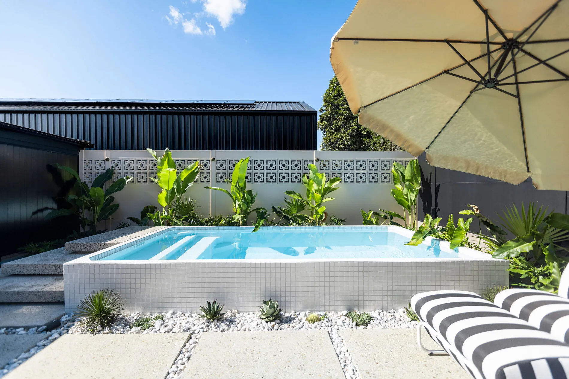 A Plungie plunge pool installed on a sloping Brisbane block