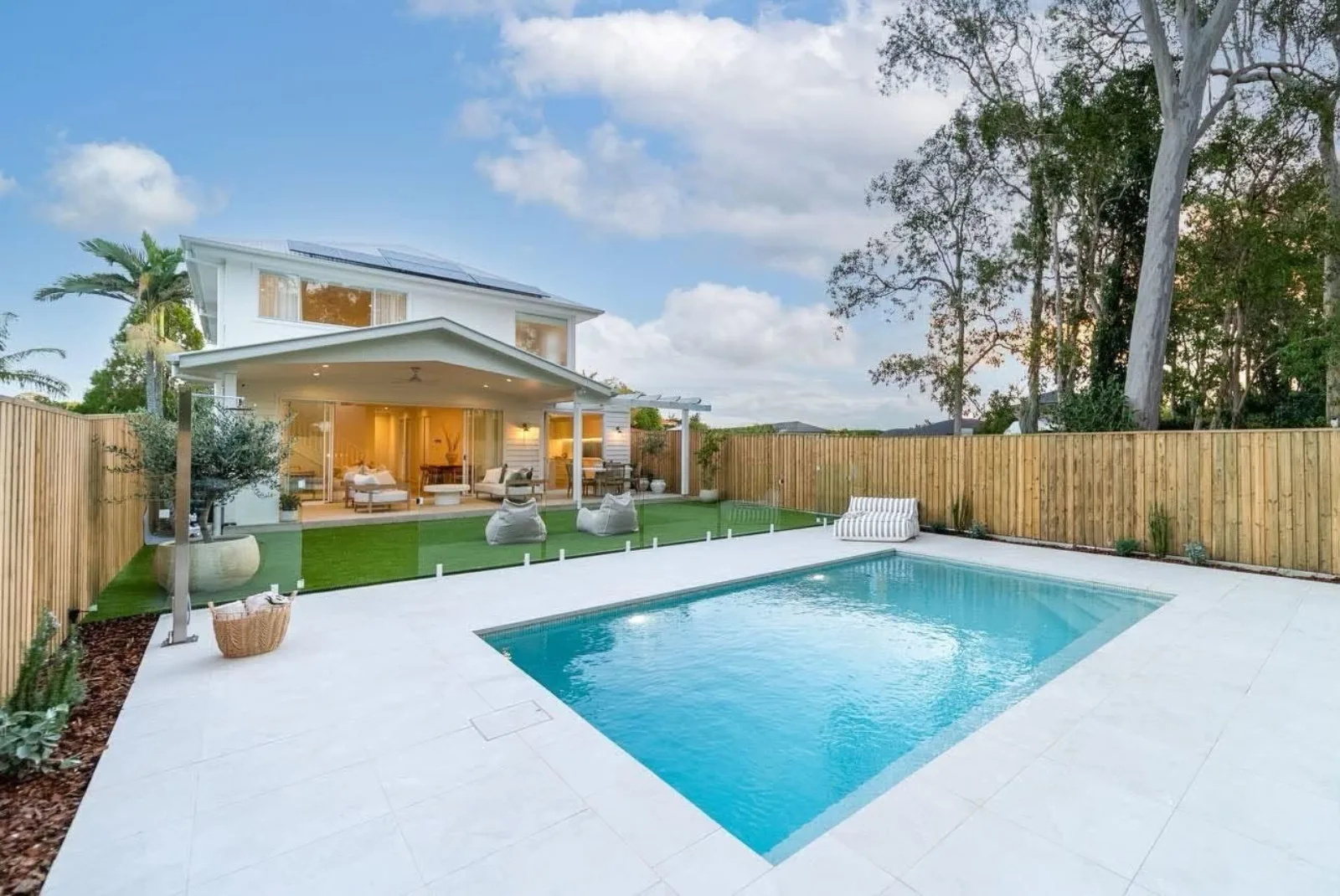 Custom pool and outdoor living at dusk, Ormiston