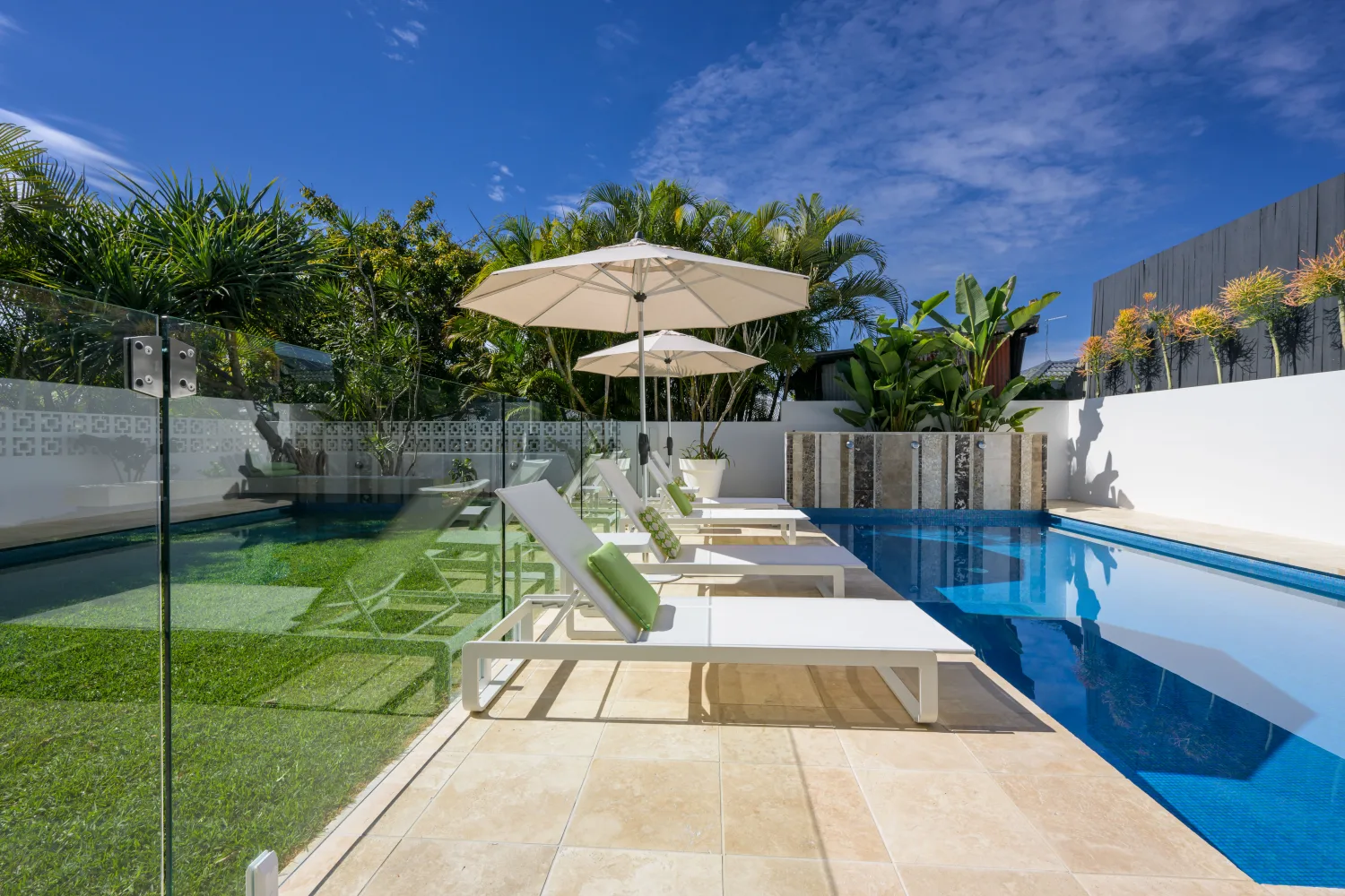 Custom pool with sun lounges and glass fencing, Paddington