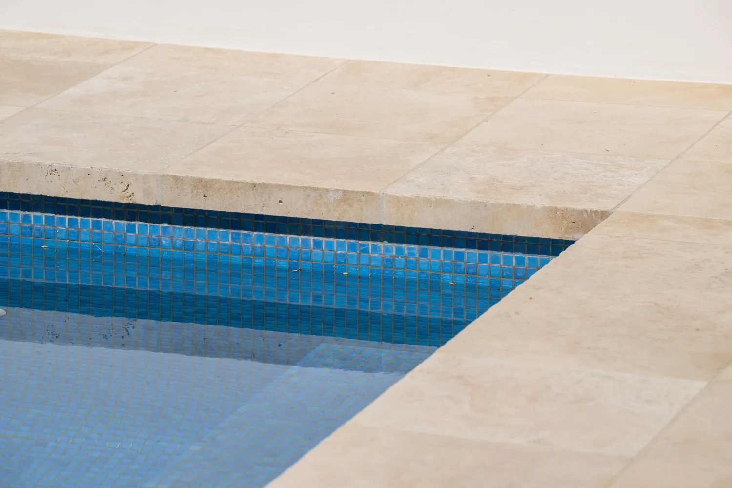 Waterline tile and travertine coping detail, Paddington