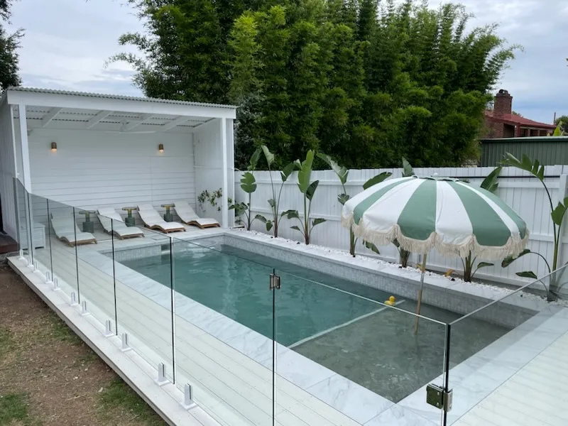 Plunge-style pool with cabana